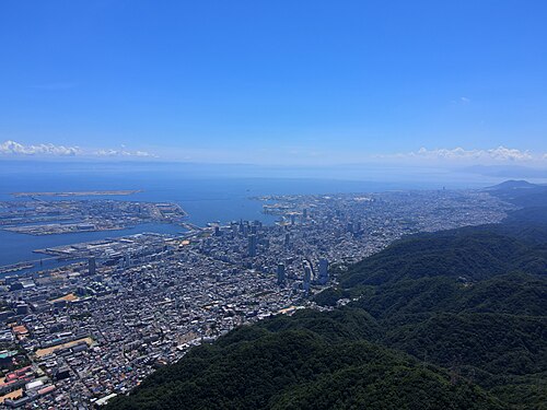 Aerial drone shot of Kobe City from above Mount Maya