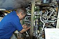 Thomas Reiter working on the internal thermal cooling loop pump in the Zvezda Service Module
