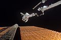 Astronaut Scott Parazynski of STS-120 during a spacewalk to repair (essentially sew) a damaged solar panel.